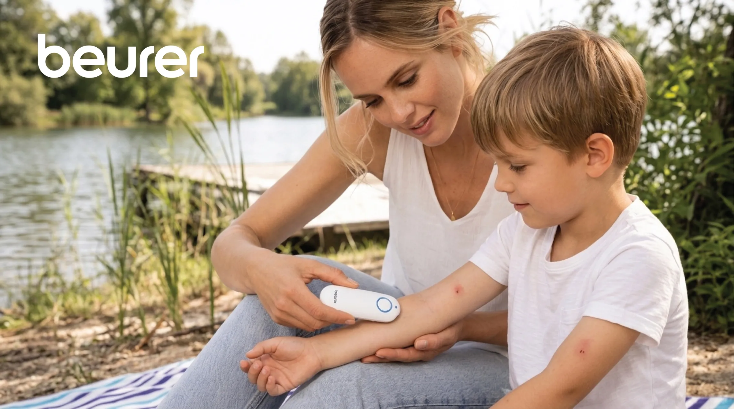 A woman holding Beurer Insect Bite Healer BR60 against a childs arm outdoors, demonstrating a quick, chemical-free treatment for a mosquito bite allergy.