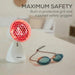 IL11 on a table with all the safety features including the red honeycomb grill and a pair of blue-tinted safety goggles on a light tabletop. 