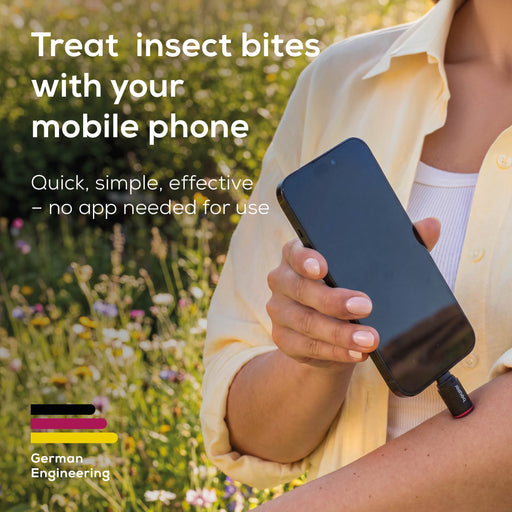 Person holding a phone with a BR70 device attached, in a field with text about treating insect bites.